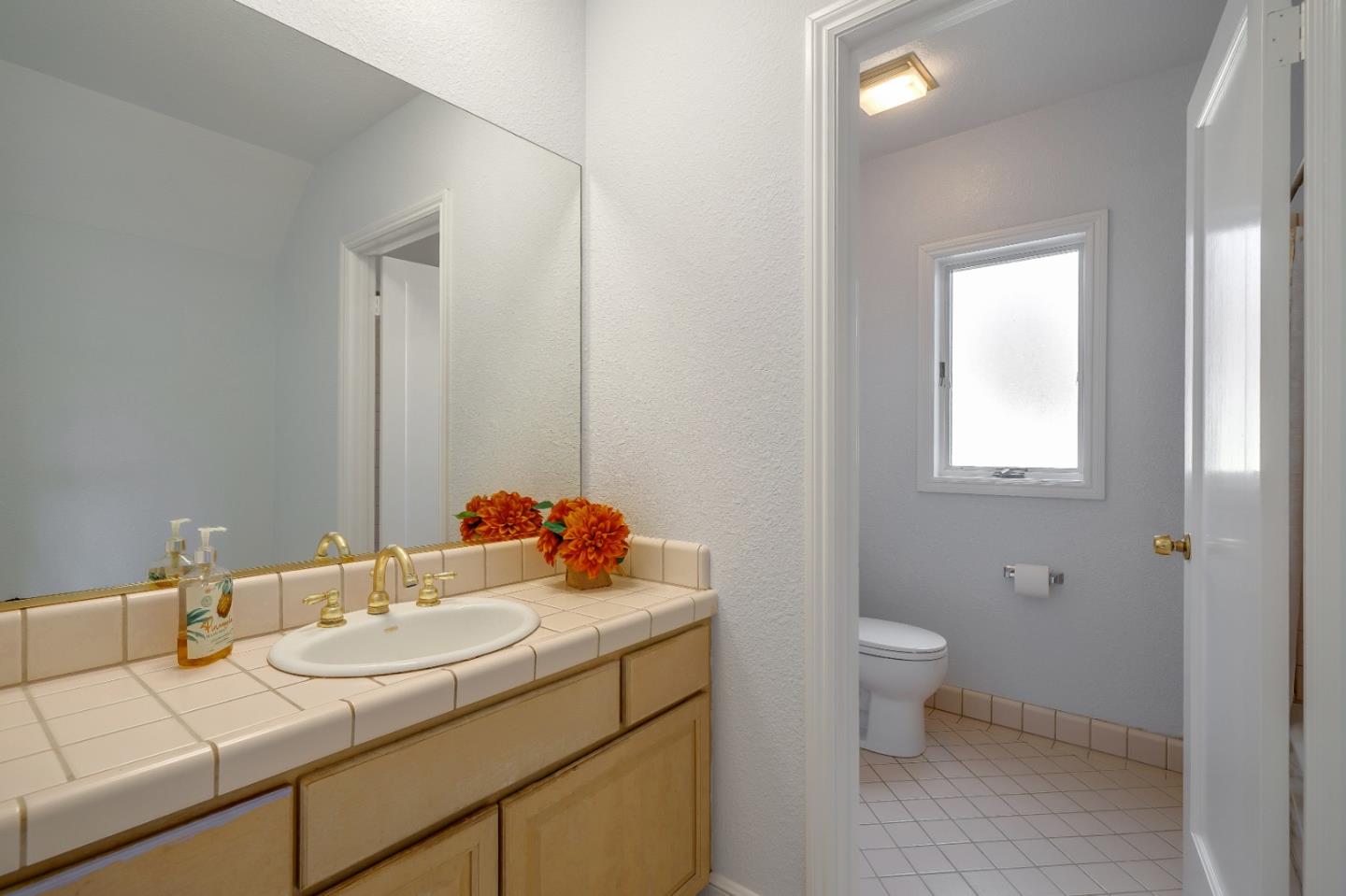 40 Bloomfield Road Burlingame, CA 94010 - Photo 38 of 45 a bathroom with a sink toilet and mirror