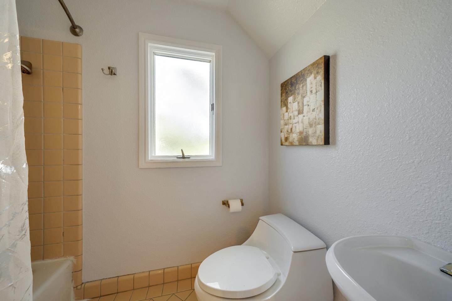 40 Bloomfield Road Burlingame, CA 94010 - Photo 40 of 45 a white toilet sitting next to a bath tub