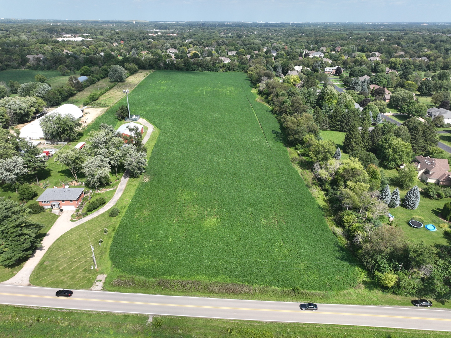Lot 0 Munger Road Wayne, IL 60184 - Photo 2 of 11 an aerial view of a residential houses with outdoor space and trees