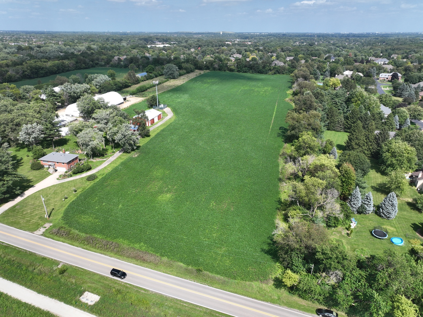 Lot 0 Munger Road Wayne, IL 60184 - Photo 5 of 11 a view of a green yard with a lake