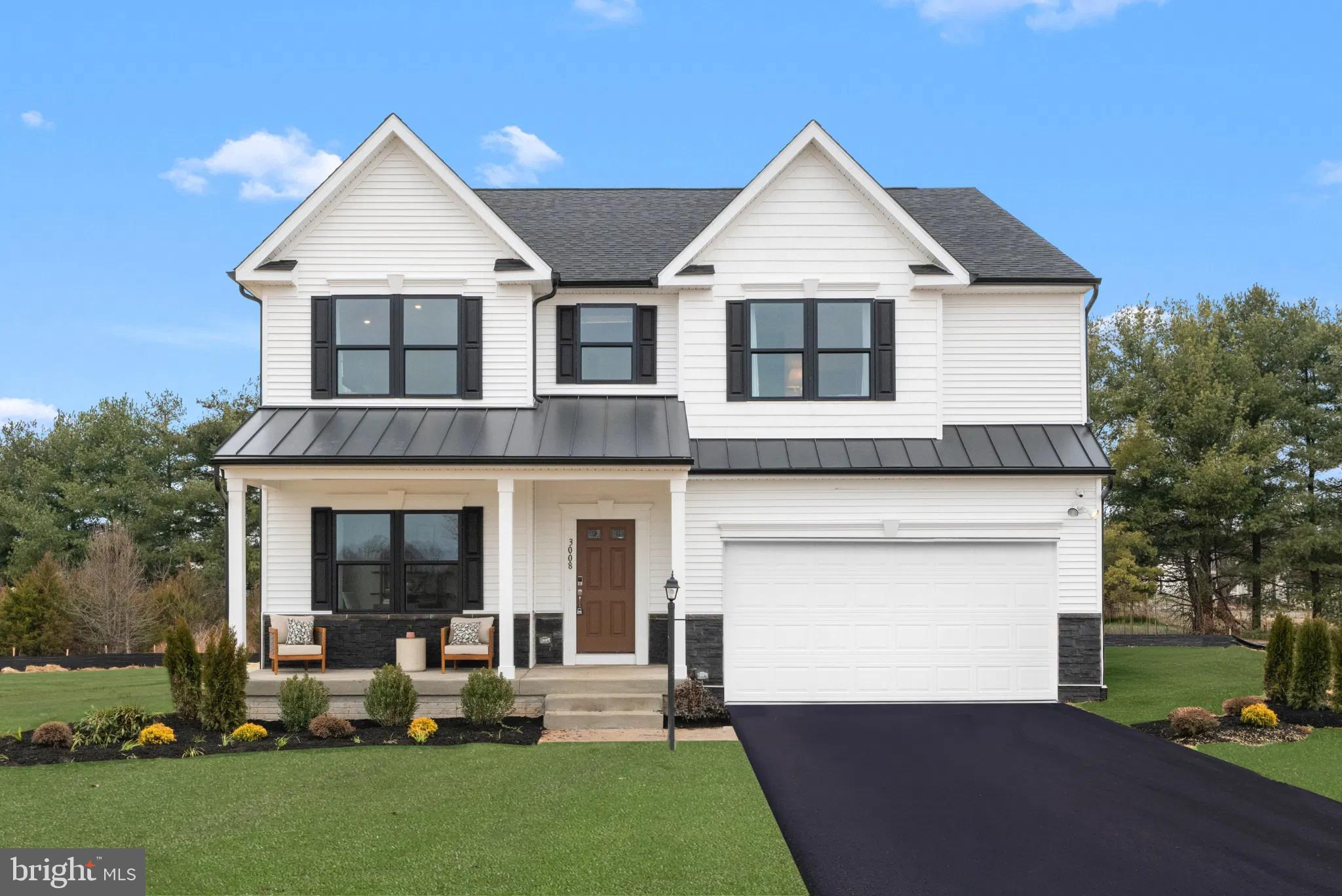154 Williamson Road Winchester, VA 22602 - Photo 1 of 10 a front view of a house with a garden and plants