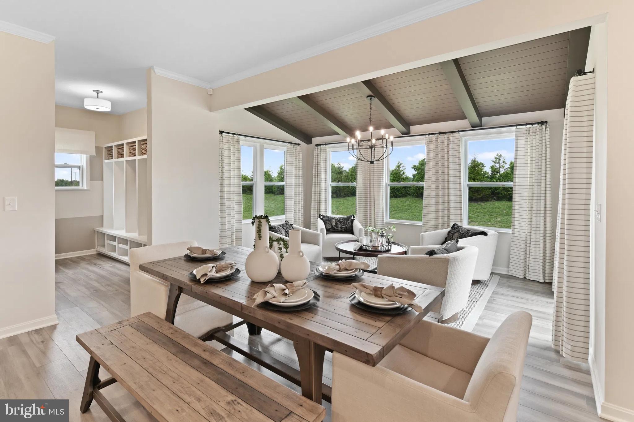 154 Williamson Road Winchester, VA 22602 - Photo 4 of 10 a dining room with furniture a chandelier and wooden floor