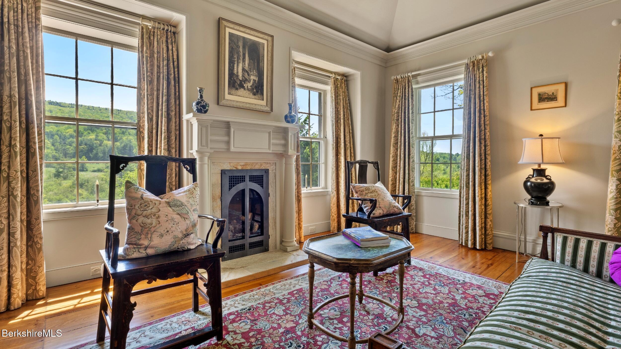 2650 Swamp Road Richmond, MA 01254 - Photo 22 of 49 a living room with furniture a window and a fireplace
