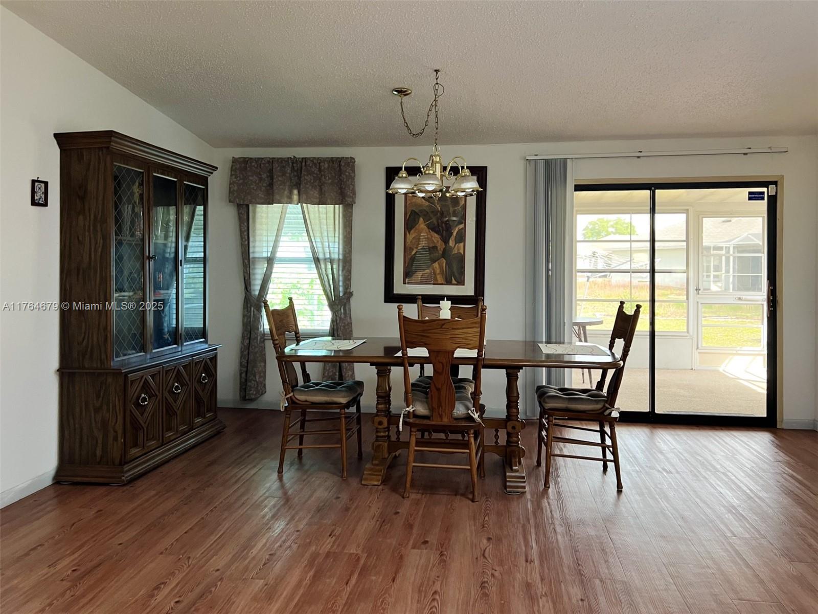 6367 Southwest 83rd Place Ocala, FL 34476 - Photo 11 of 47 a view of a dining room with furniture window and wooden floor