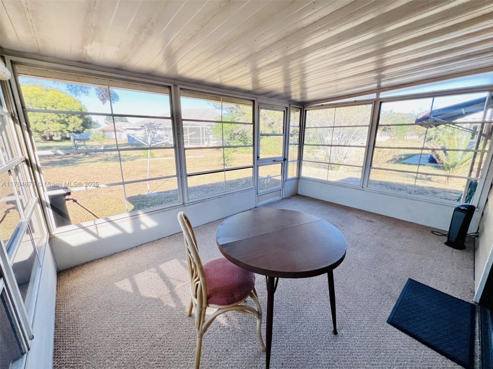 6367 Southwest 83rd Place Ocala, FL 34476 - Photo 12 of 47 a room with furniture and a large window