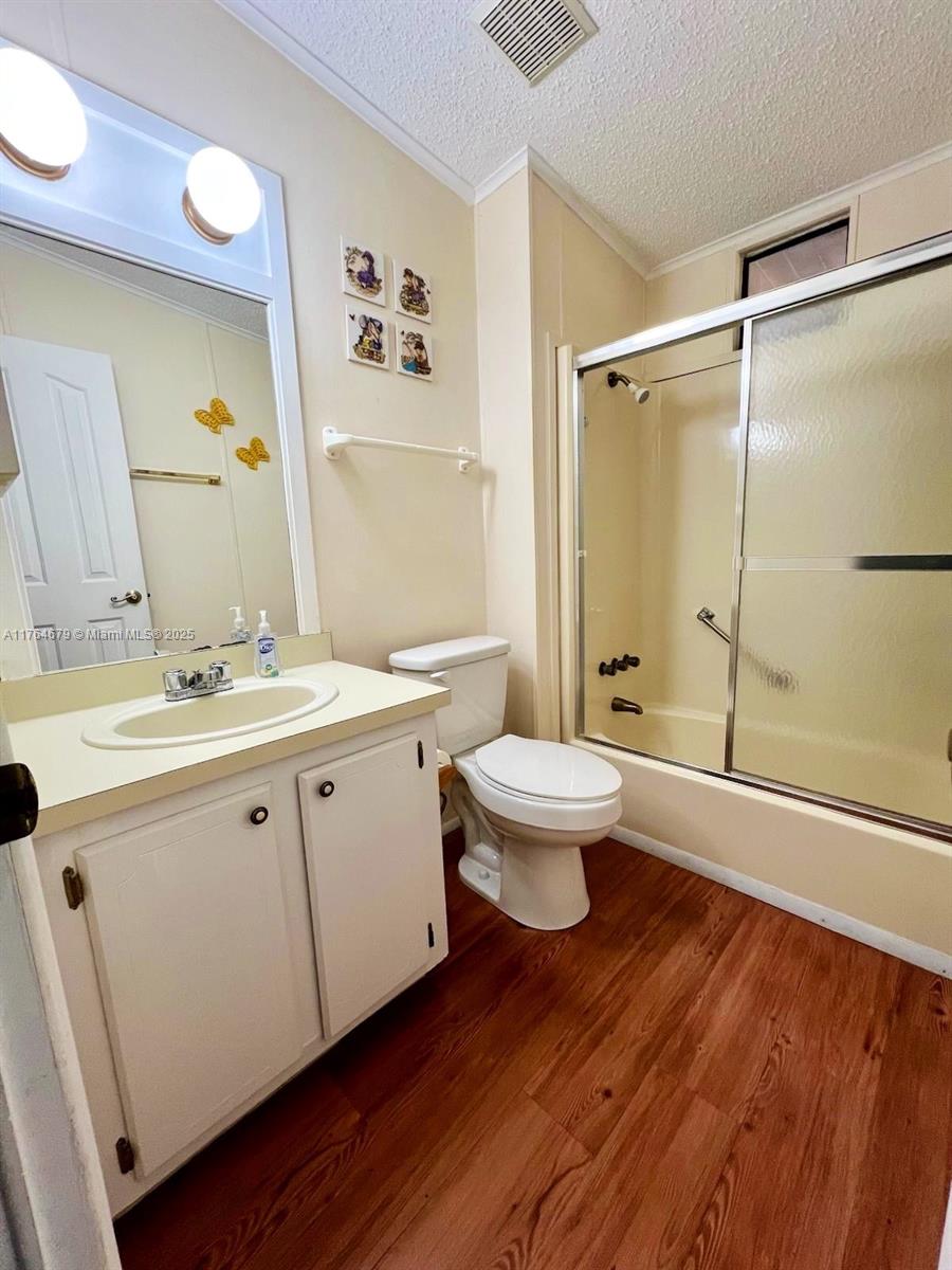 6367 Southwest 83rd Place Ocala, FL 34476 - Photo 14 of 47 a bathroom with a double vanity sink toilet and shower