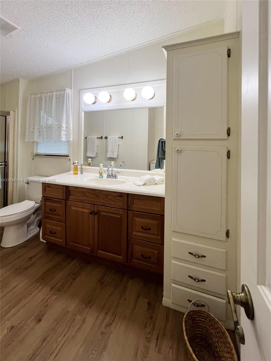 6367 Southwest 83rd Place Ocala, FL 34476 - Photo 20 of 47 a room with a dresser and a mirror