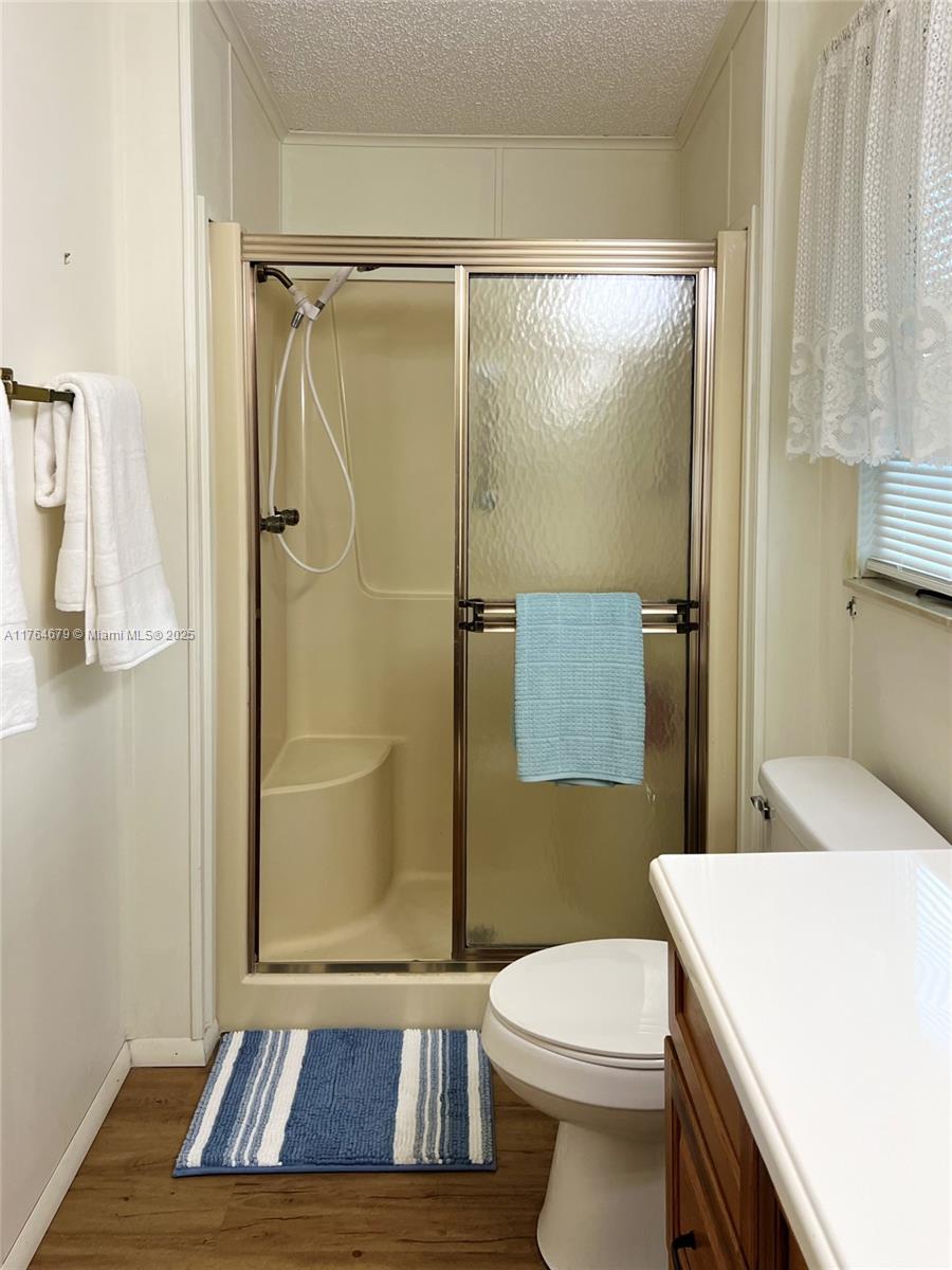 6367 Southwest 83rd Place Ocala, FL 34476 - Photo 21 of 47 a bathroom with a sink a toilet a shower and a mirror