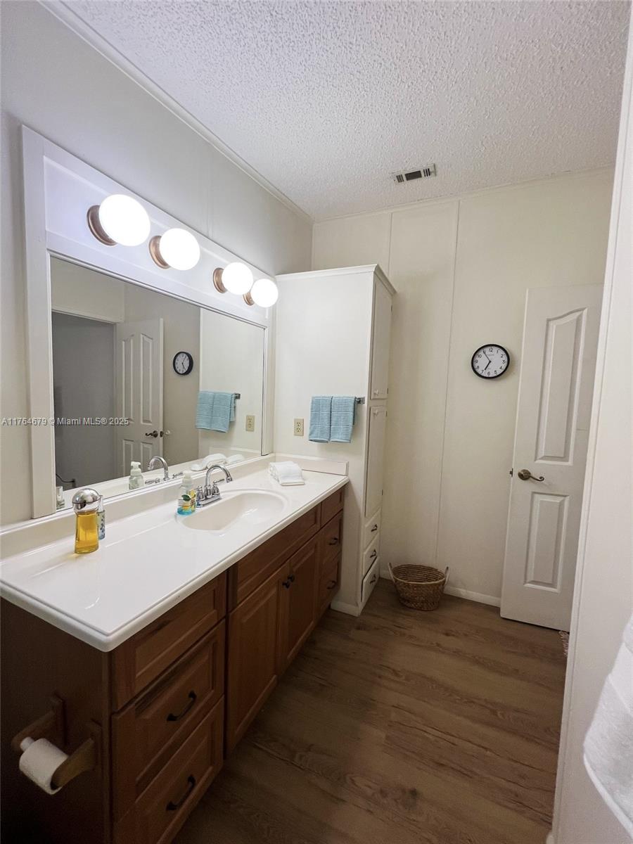 6367 Southwest 83rd Place Ocala, FL 34476 - Photo 22 of 47 a bathroom with a sink mirror and vanity