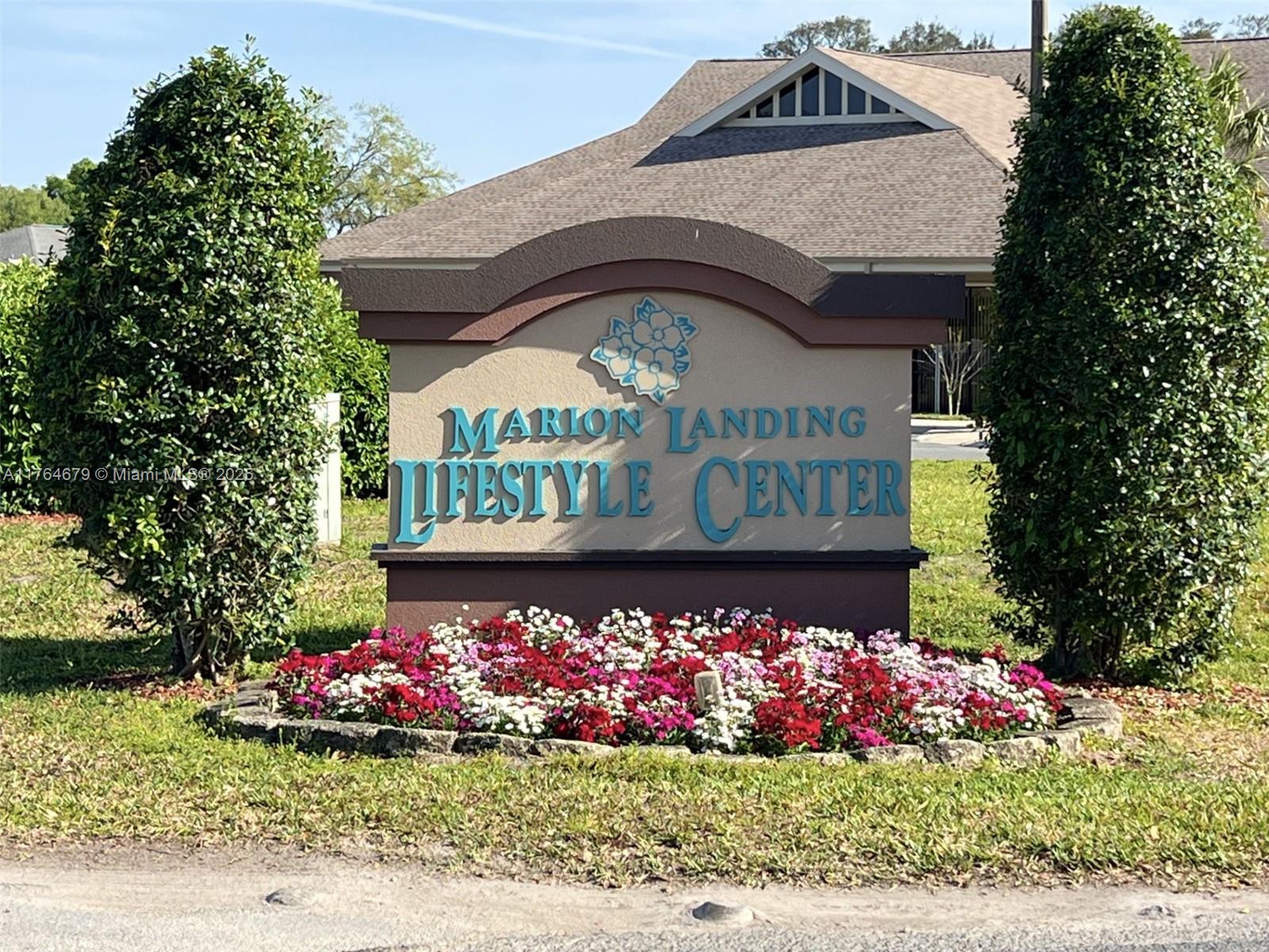 6367 Southwest 83rd Place Ocala, FL 34476 - Photo 31 of 47 a view of sign board with flowers