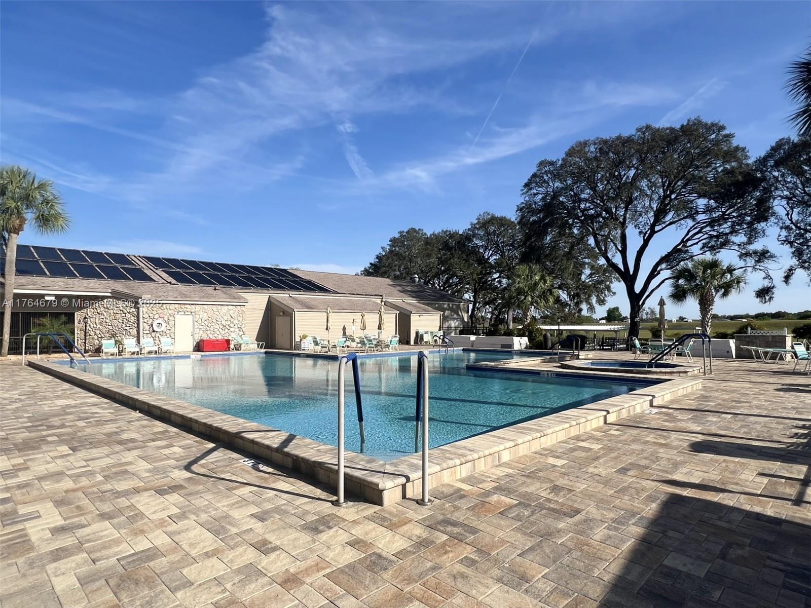 6367 Southwest 83rd Place Ocala, FL 34476 - Photo 40 of 47 a view of a swimming pool with an outdoor space