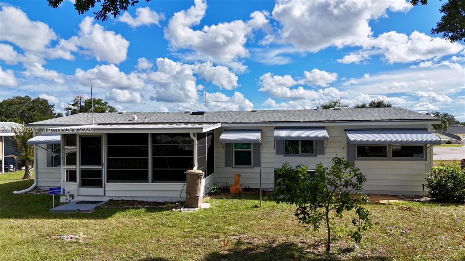 6367 Southwest 83rd Place Ocala, FL 34476 - Photo 4 of 47 a view of a house with a yard