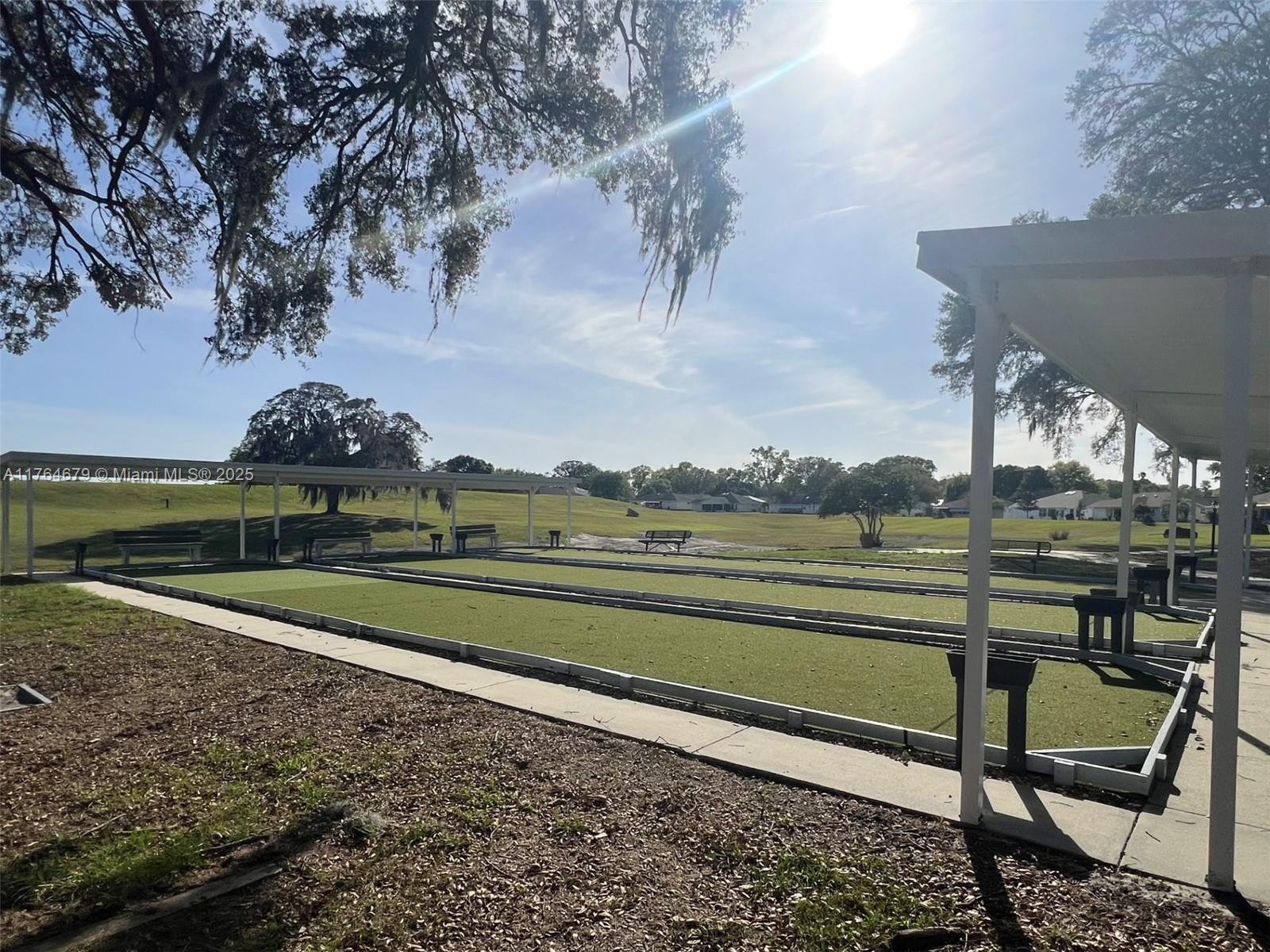 6367 Southwest 83rd Place Ocala, FL 34476 - Photo 43 of 47 a view of a table and chairs in the garden