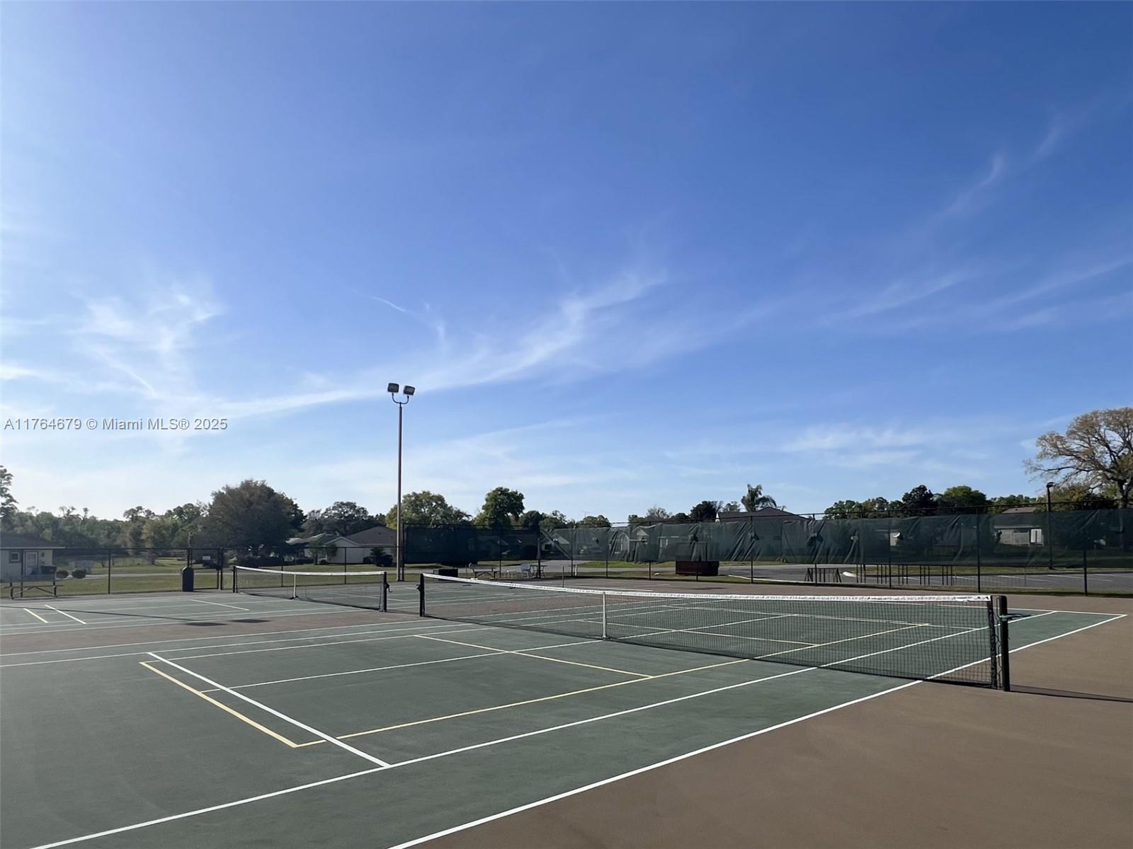 6367 Southwest 83rd Place Ocala, FL 34476 - Photo 44 of 47 a view of tennis court