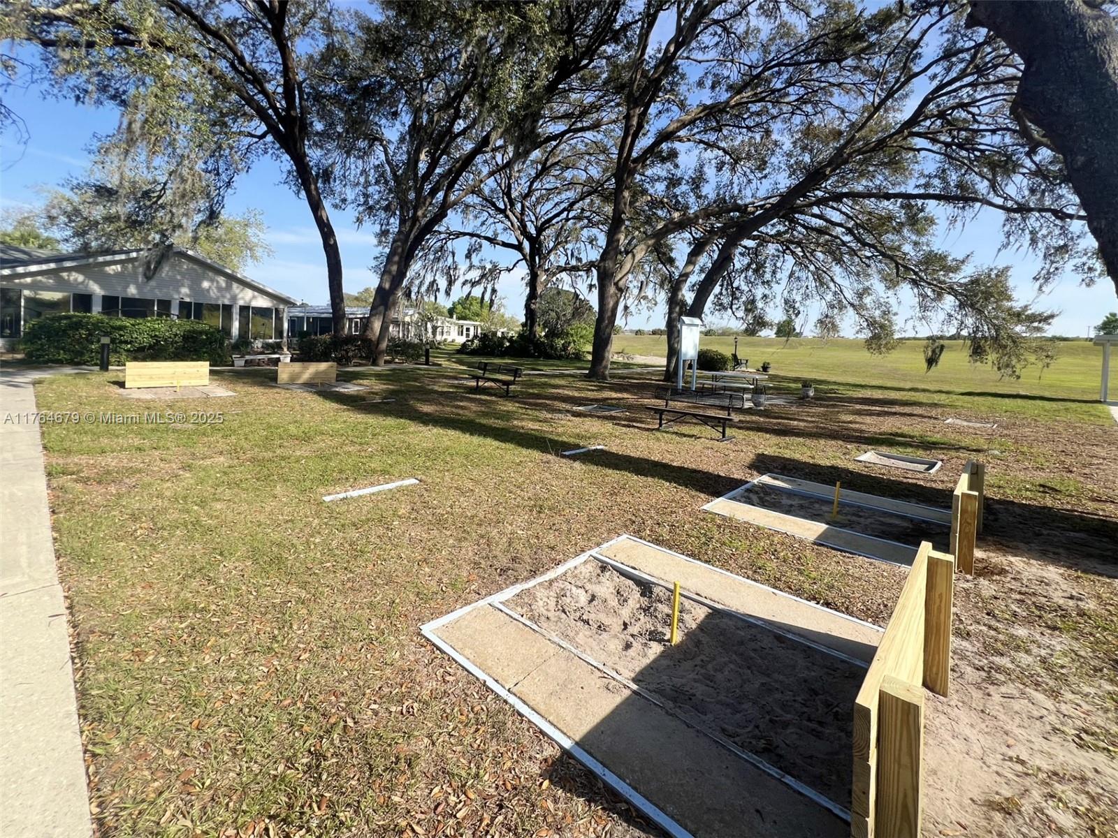 6367 Southwest 83rd Place Ocala, FL 34476 - Photo 45 of 47 a view of a yard with swimming pool