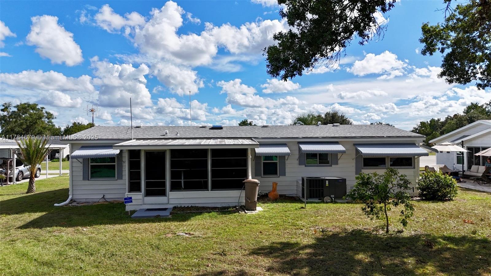 6367 Southwest 83rd Place Ocala, FL 34476 - Photo 5 of 47 a view of a house with a yard and sitting area