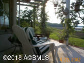 125 Fripp Point Road St. Helena Island, SC 29920 - Photo 1 of 26 Pergola chairs