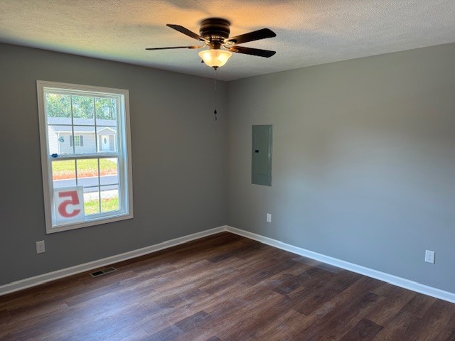 159 Hesselly Road Decherd, TN 37324 - Photo 2 of 12 wooden floor in an empty room with a window