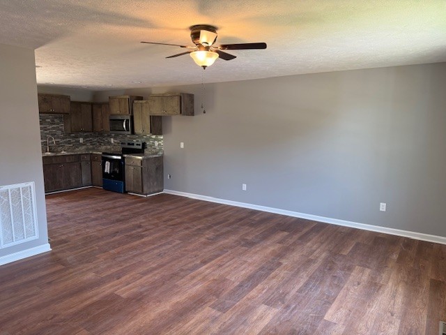 159 Hesselly Road Decherd, TN 37324 - Photo 4 of 12 a view of a kitchen with a sink and a stove top oven