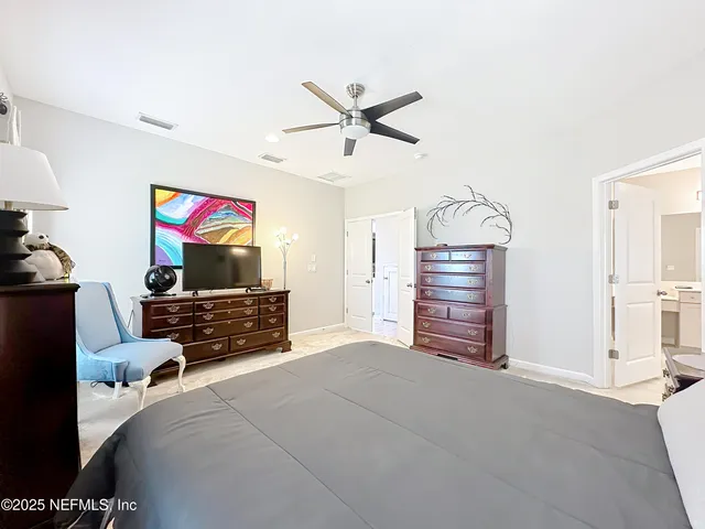 a bathroom with a shower and a sink