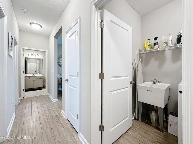 a bed sitting in a bedroom next to a window