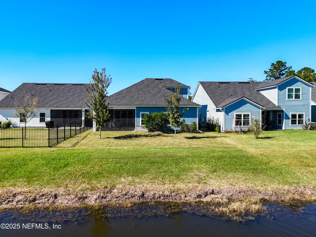 a aerial view of a house with a swimming pool