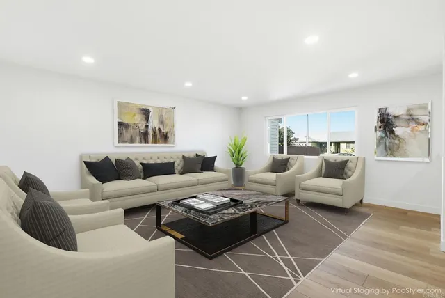 a living room with furniture and a rug