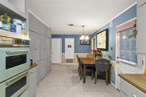 a view of a kitchen and dining room