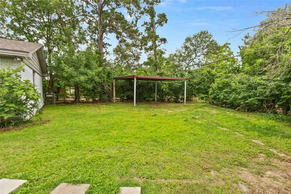 a backyard of a house with lots of green space
