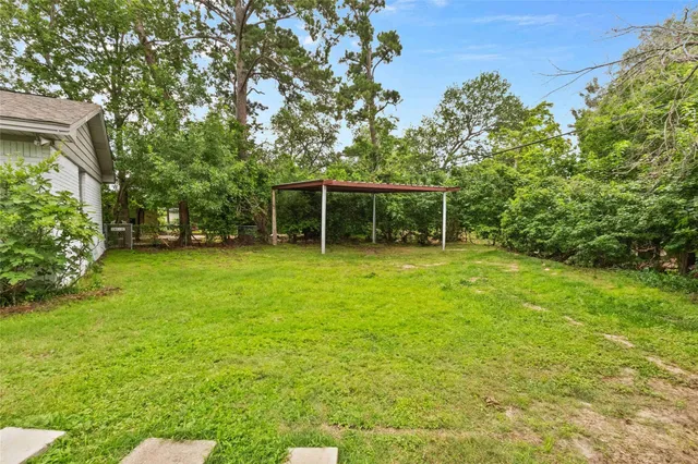 a backyard of a house with lots of green space