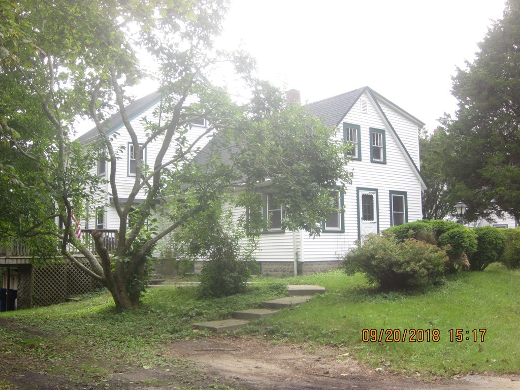 26 Waterhouse Road Bourne, MA 02532 - Photo 1 of 28 a front view of a house with garden
