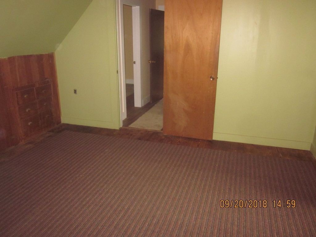 26 Waterhouse Road Bourne, MA 02532 - Photo 20 of 28 an empty room with wooden floor