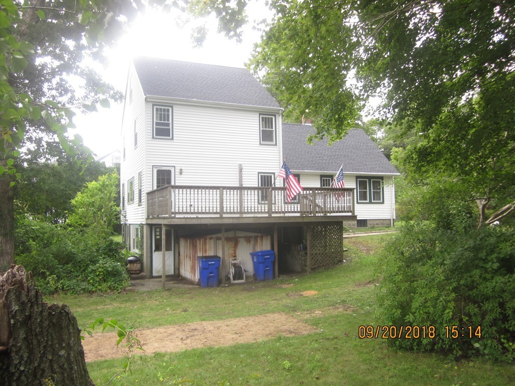 26 Waterhouse Road Bourne, MA 02532 - Photo 2 of 28 a view of a house with a yard and sitting area