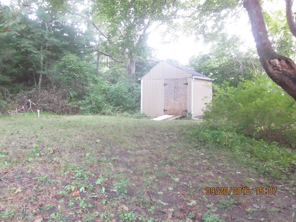 26 Waterhouse Road Bourne, MA 02532 - Photo 28 of 28 a view of a dry yard with large trees