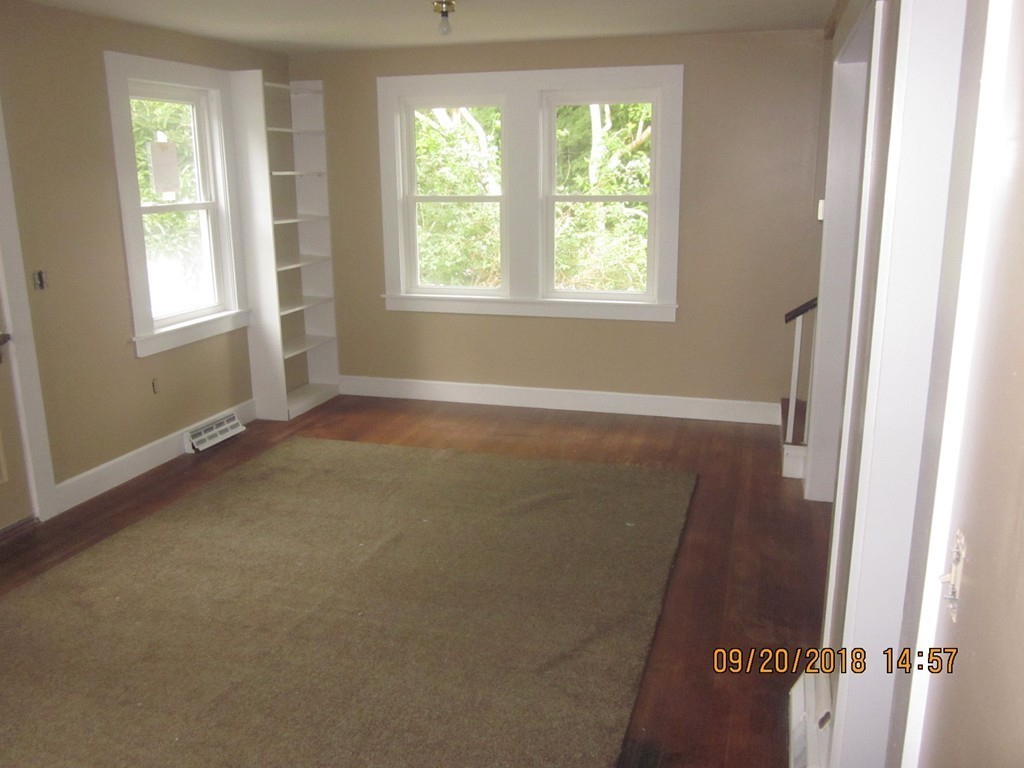 26 Waterhouse Road Bourne, MA 02532 - Photo 4 of 28 an empty room with windows