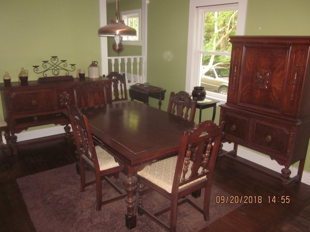 26 Waterhouse Road Bourne, MA 02532 - Photo 10 of 28 a view of a dining room with furniture and chandelier