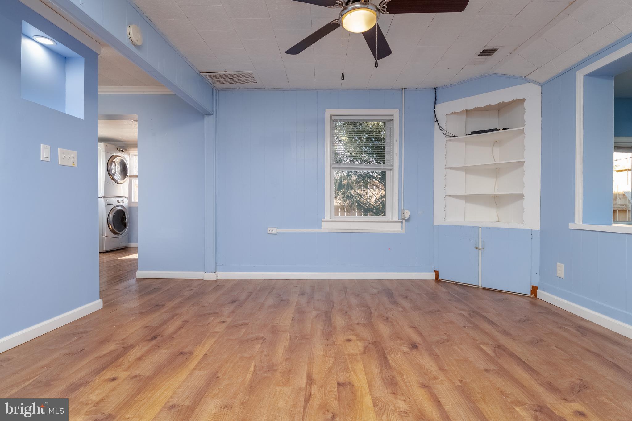 3171 Baybriar Road Dundalk, MD 21222 - Photo 11 of 41 a view of an empty room with a window and wooden floor