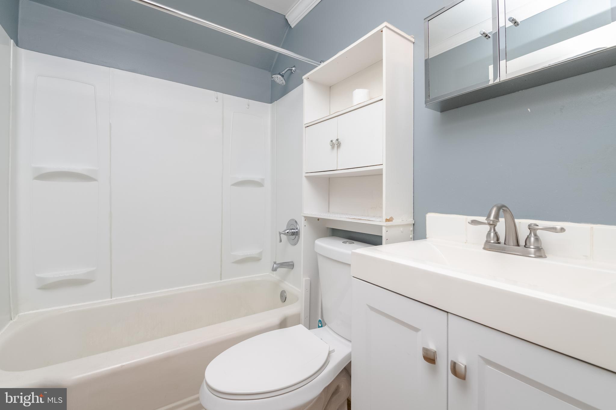 3171 Baybriar Road Dundalk, MD 21222 - Photo 21 of 41 a bathroom with a sink toilet vanity and bathtub