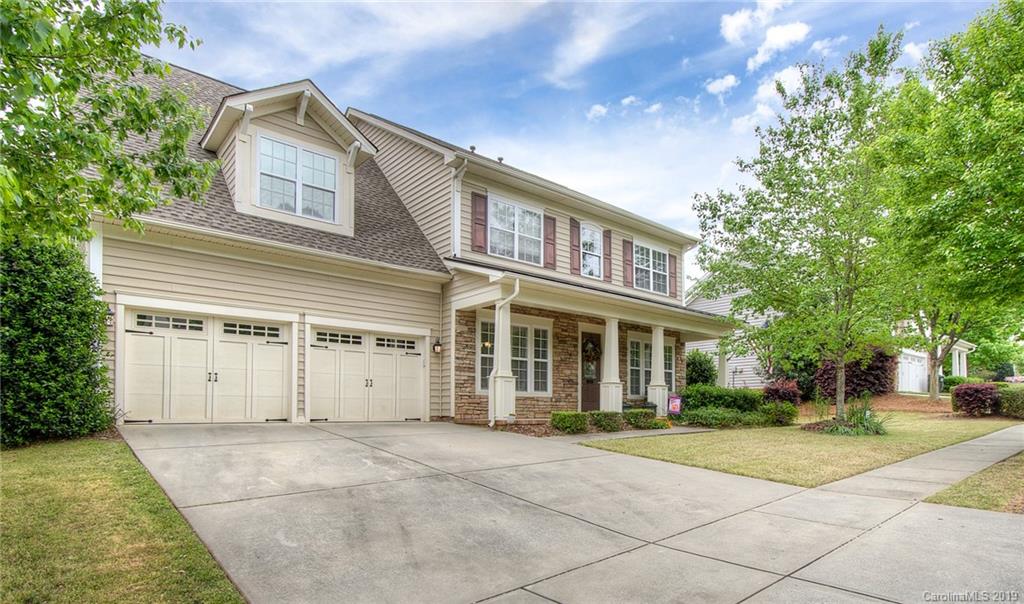 538 Quicksilver Trail Fort Mill, SC 29708 - Photo 2 of 39 a view of a white building among the street with palm trees