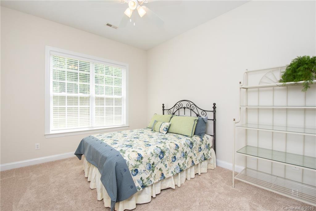 538 Quicksilver Trail Fort Mill, SC 29708 - Photo 13 of 39 a bedroom with a bed and a window
