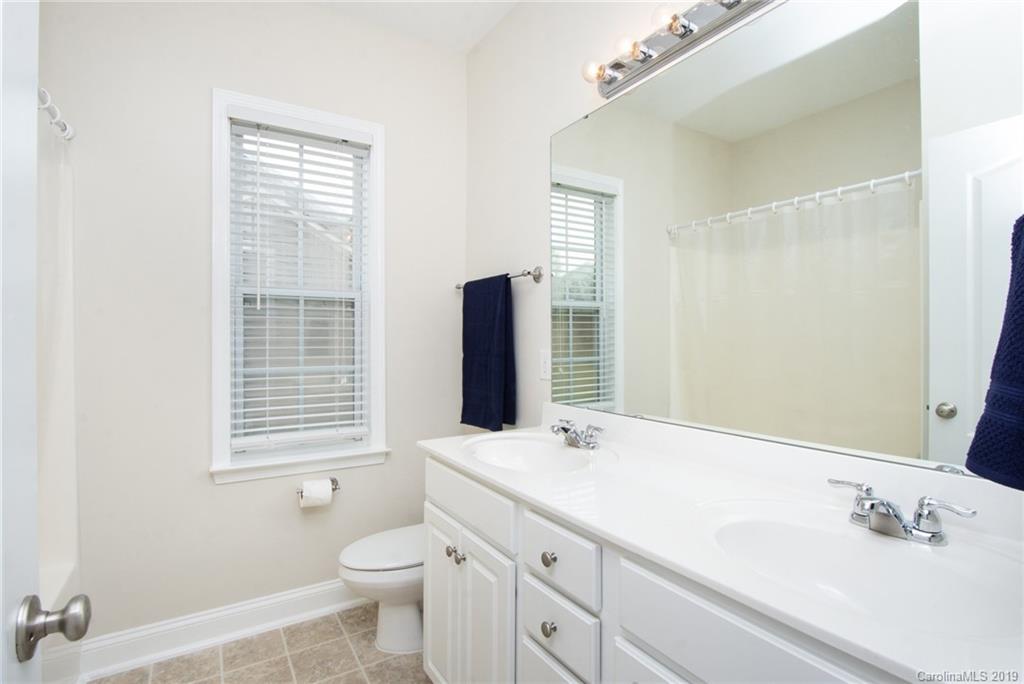 538 Quicksilver Trail Fort Mill, SC 29708 - Photo 14 of 39 a bathroom with a double vanity sink toilet and a mirror