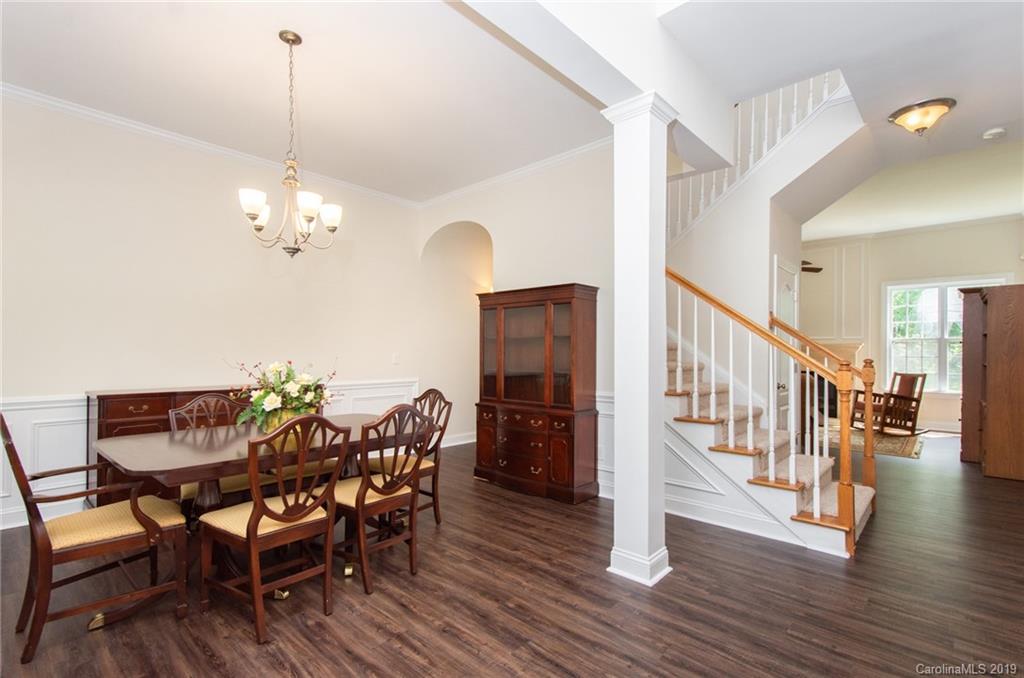 538 Quicksilver Trail Fort Mill, SC 29708 - Photo 3 of 39 a view of a dining room with furniture and wooden floor