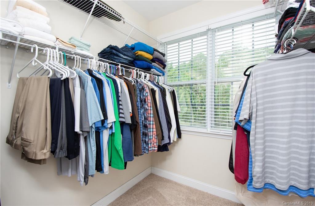 538 Quicksilver Trail Fort Mill, SC 29708 - Photo 23 of 39 a view of walk in closet with clothes and shoes