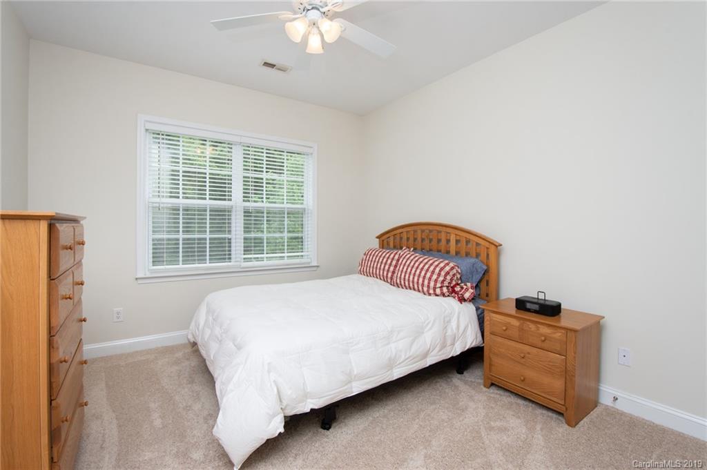 538 Quicksilver Trail Fort Mill, SC 29708 - Photo 26 of 39 a bedroom with a bed and a window