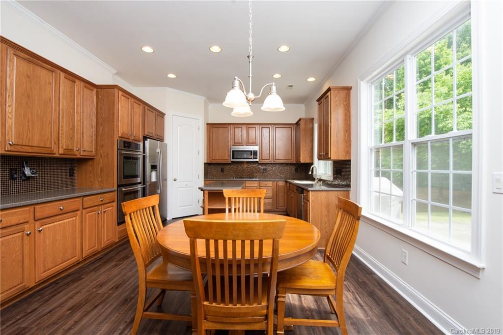 538 Quicksilver Trail Fort Mill, SC 29708 - Photo 10 of 39 a view of a dining room with furniture window and outside view