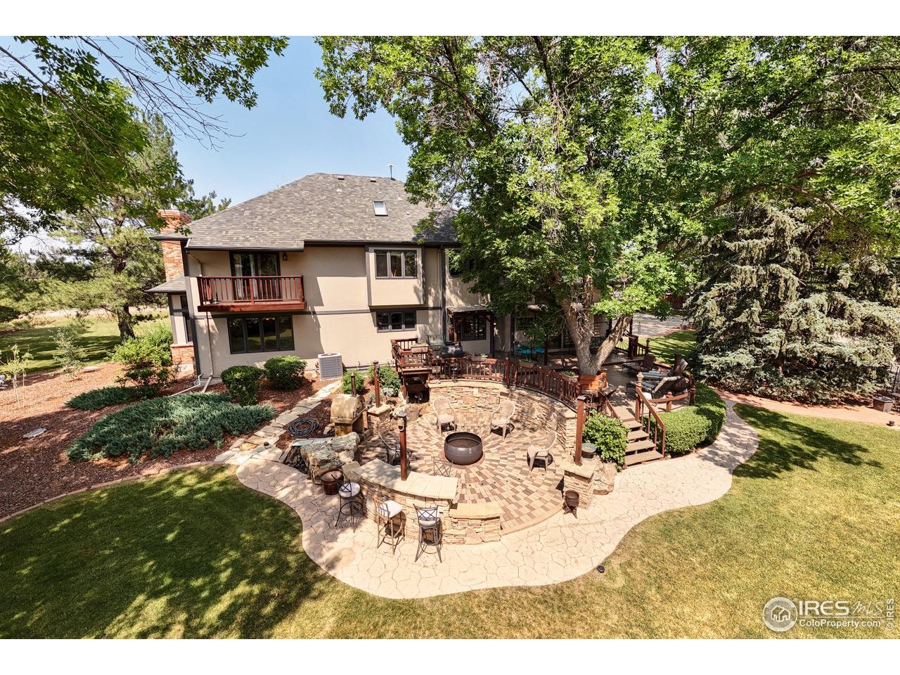 9020 Rogers Road Longmont, CO 80503 - Photo 36 of 39 a view of a dinning table and chairs in the patio