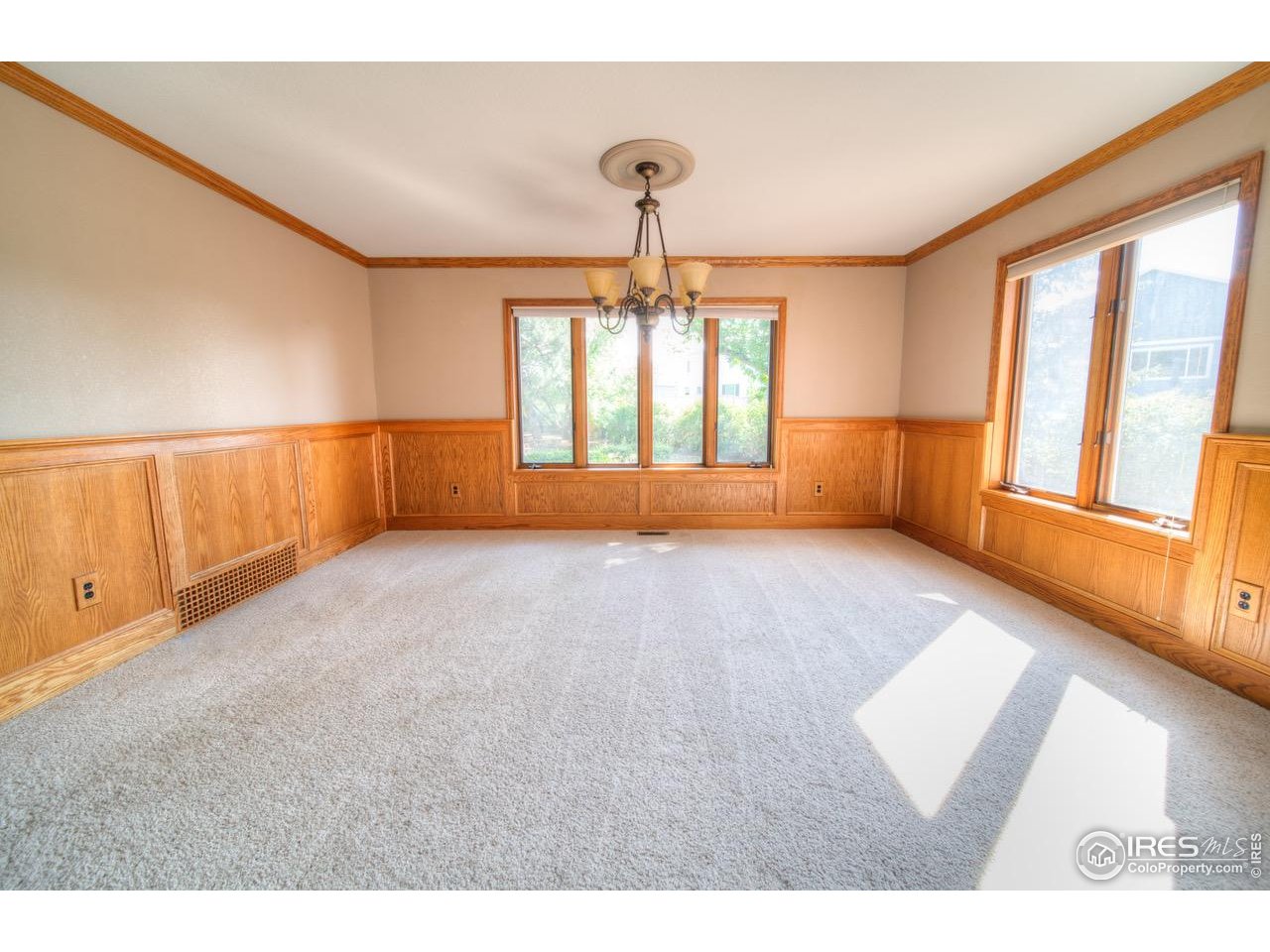 9020 Rogers Road Longmont, CO 80503 - Photo 6 of 39 a view of an empty room with a window