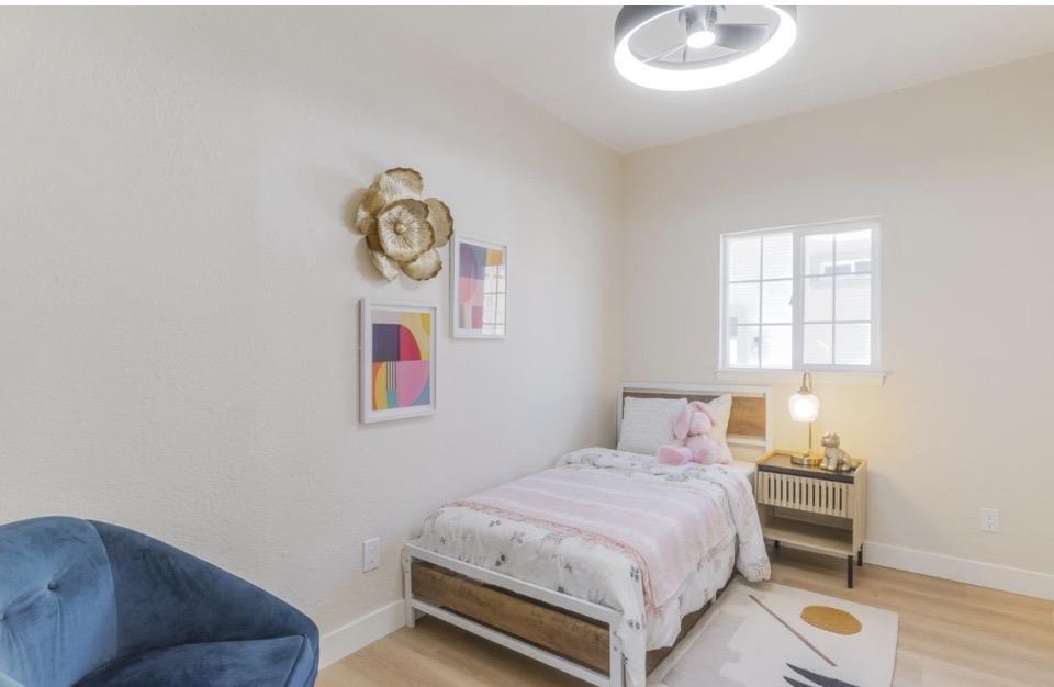 735 Locust Street San Jose, CA 95110 - Photo 16 of 21 a bedroom with a bed and a window