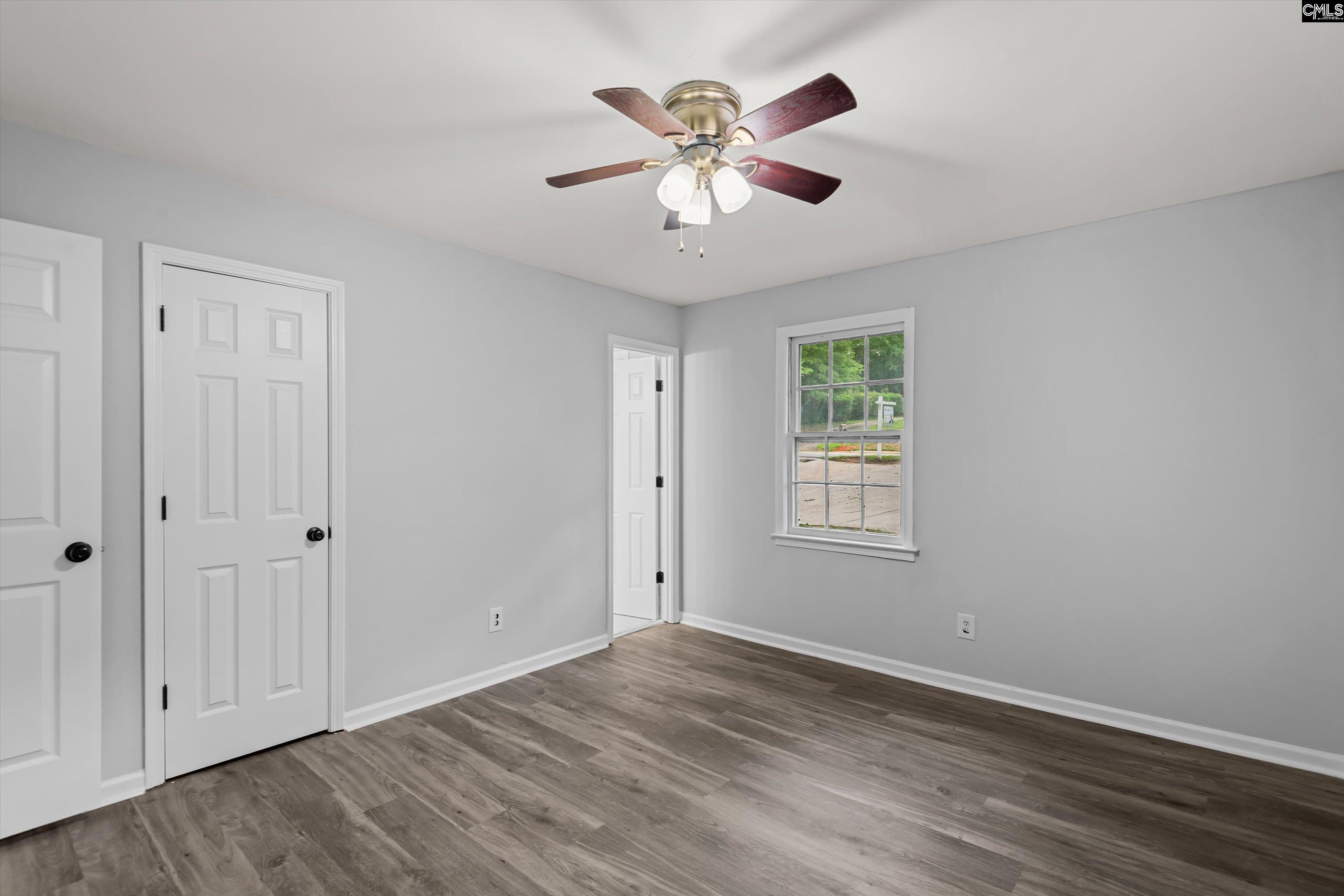 245 Piney Grove Road Columbia, SC 29210 - Photo 16 of 29 a view of an empty room with window and wooden floor