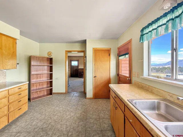 a kitchen with a sink and a window